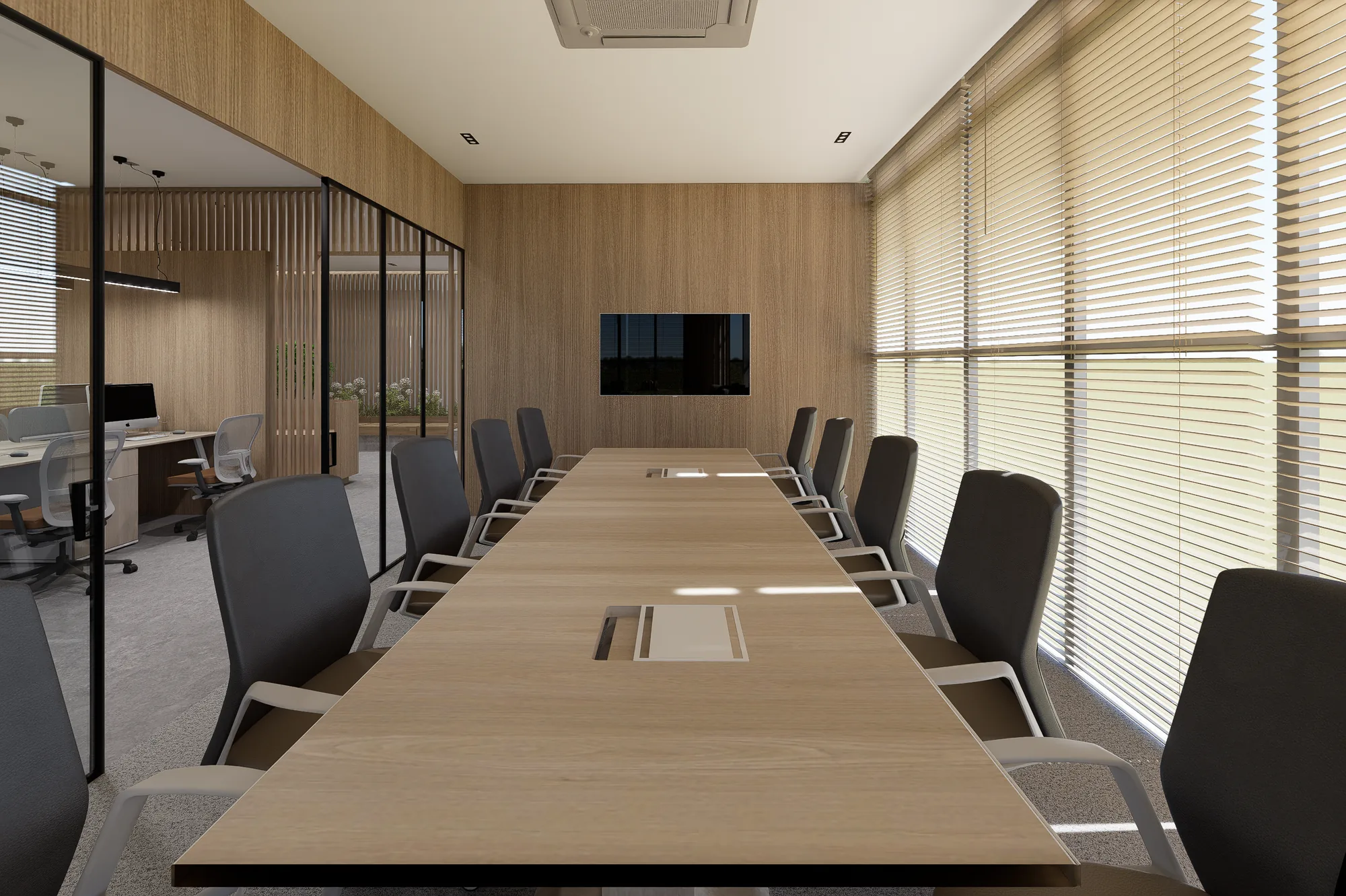 The boardroom table, looking down its length to the screen